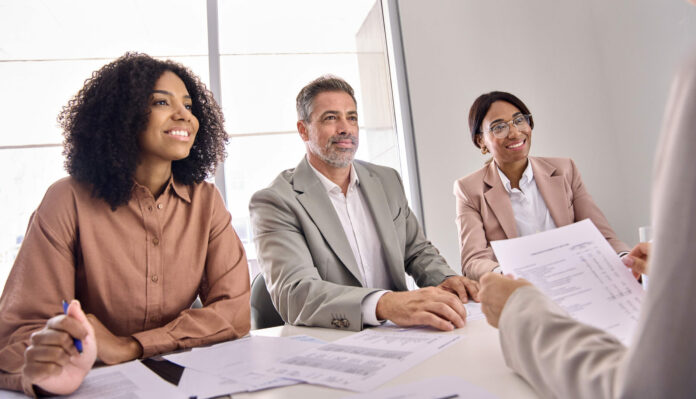 Happy busy lawyers hr office team having business work meeting or interview.